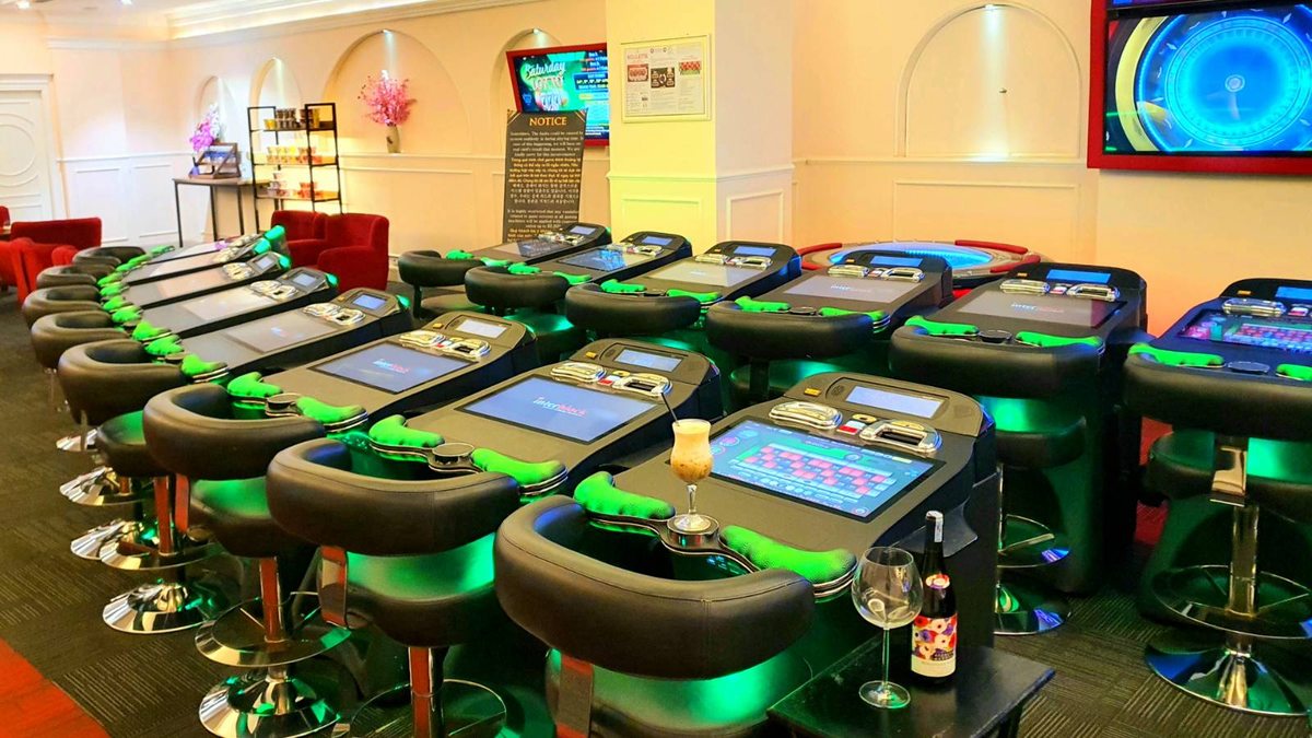Modern electronic roulette tables and comfortable seating inside Club One Opera casino in Da Nang.